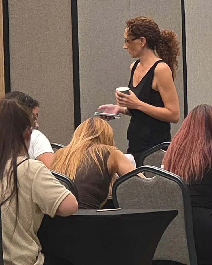 A founding trainer watching over participants in the exam hall